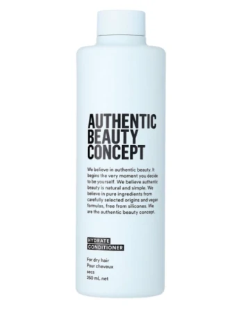 Botella de acondicionador hidratante Authentic Beauty Concept para cabello seco con diseño minimalista en blanco sobre fondo blanco